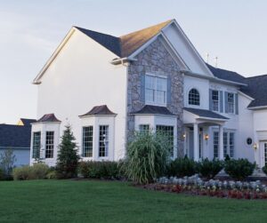 Residential metal roof and siding color combinations - cool-toned blue roof with a warmer beige siding